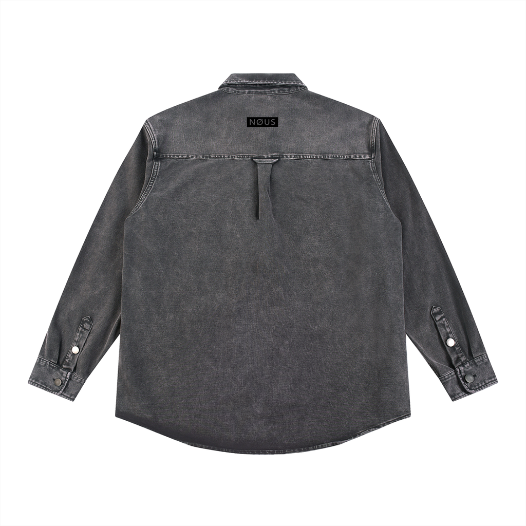 Dark denim shirt with 'NOUS' embroidery on the back against a white background